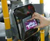 placing a T-Money card or a transportation card on the card reading machine